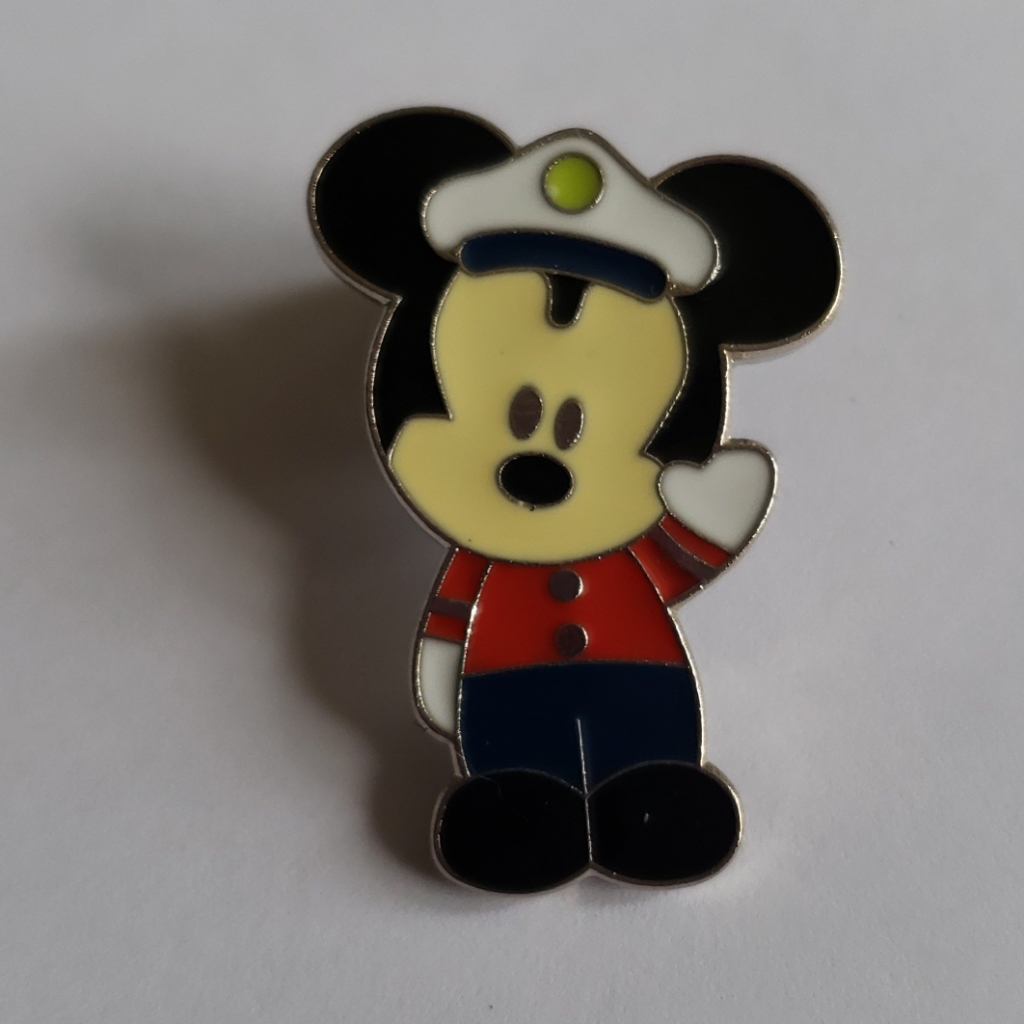 A large collection of Disney trading pins photographed for a US resale marketplace listing